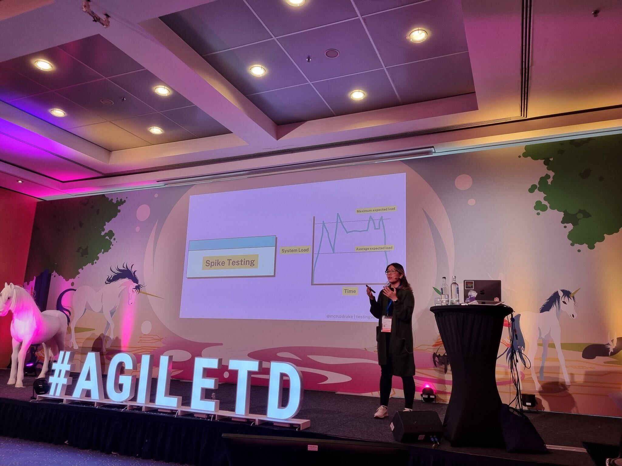 Marie Cruz on stage at Agile Testing Days 2022